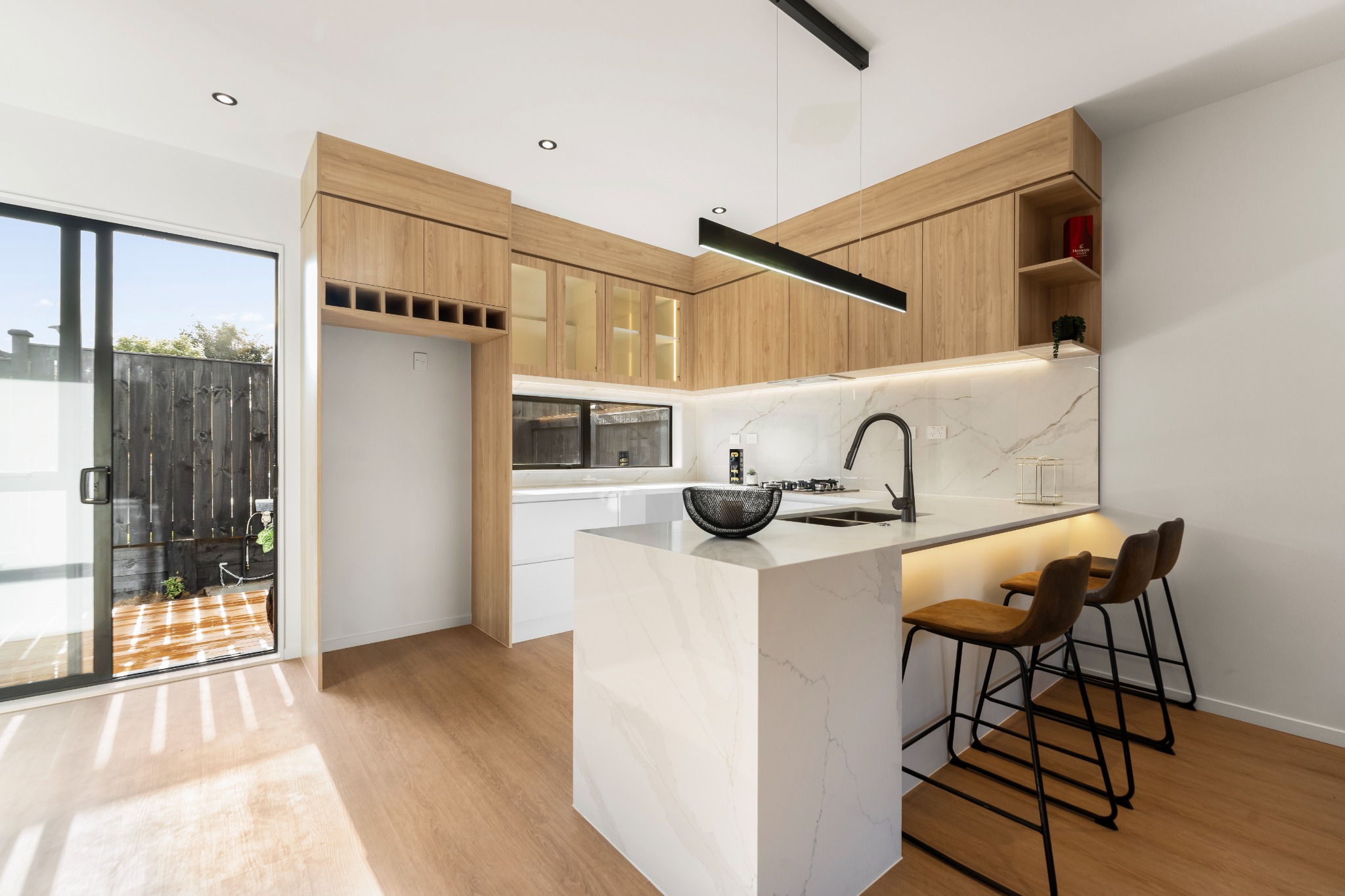 Timber and stone kitchen at Ridge Road Luxe